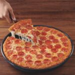 What does Pizza Hut put on their crust?