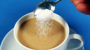 What happens when you add sugar to tea?