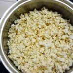 What is the best way to put butter on popcorn?