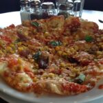 What is the most common vegetable on pizza?