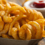 What makes curly fries taste different?