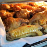 What temperature do I cook frozen chicken wings?