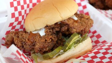 Who bought out Popeyes chicken?