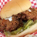 Who bought out Popeyes chicken?