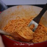 Why do you put butter in spaghetti sauce?