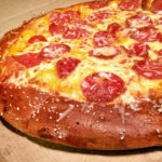 Why is Little Caesars pizza so greasy?