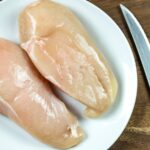 How can you tell if raw chicken is spoiled?